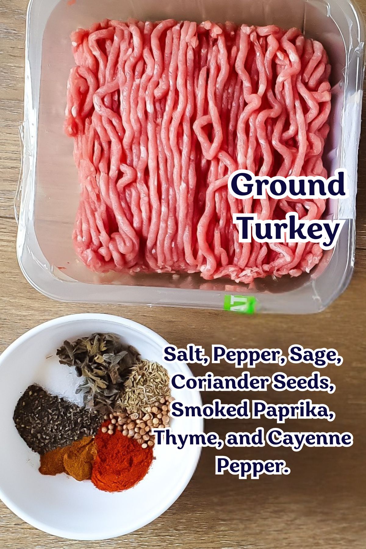 A package of raw ground turkey beside a bowl of salt, pepper, sage, coriander seeds, smoked paprika, thyme, and cayenne pepper&mdash;perfect for a high protein recipe or breakfast burrito on a wooden surface.