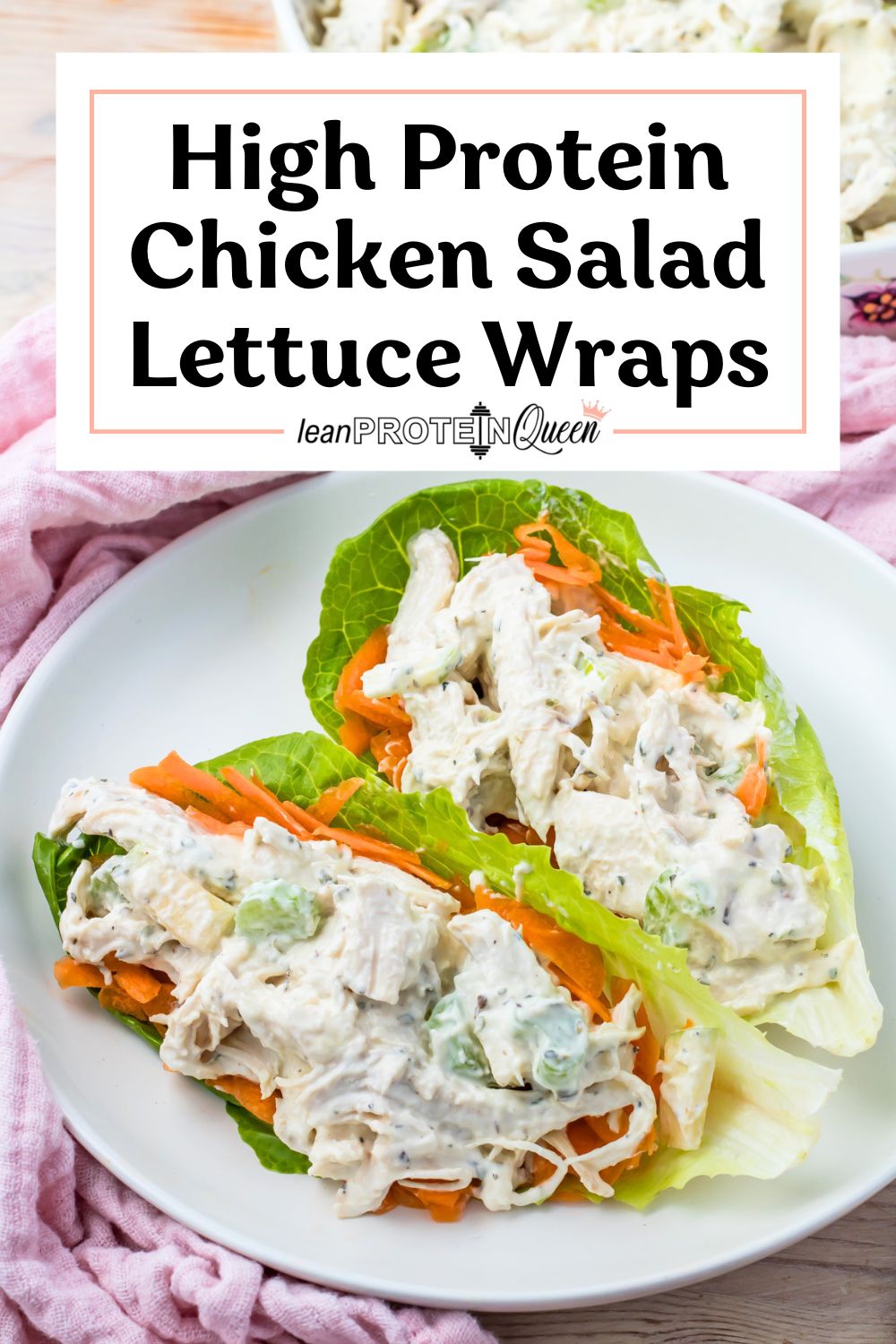 Two lettuce wraps filled with high protein chicken salad and shredded carrots sit on a white plate, with text above reading, "High Protein Chicken Salad Lettuce Wraps.