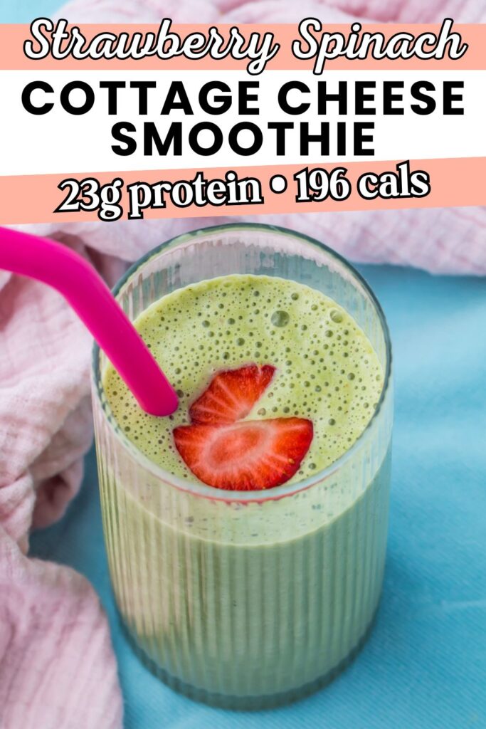 A glass of vibrant green cottage cheese smoothie with fresh strawberry slices and a pink straw, set on a blue surface next to a pink towel; text highlights &ldquo;Strawberry Spinach Cottage Cheese Smoothie.&rdquo;.