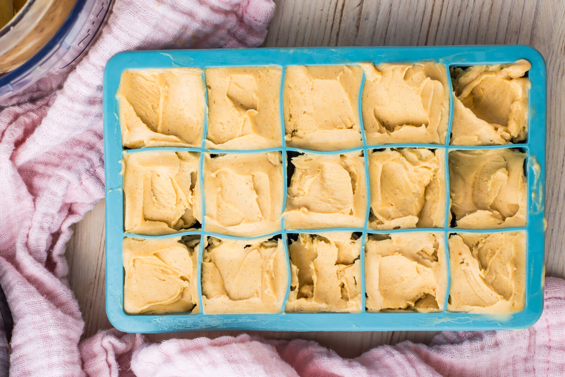 A clever way to store leftover Ninja Creami ice cream, this ice cube tray is filled with a creamy ice cream.